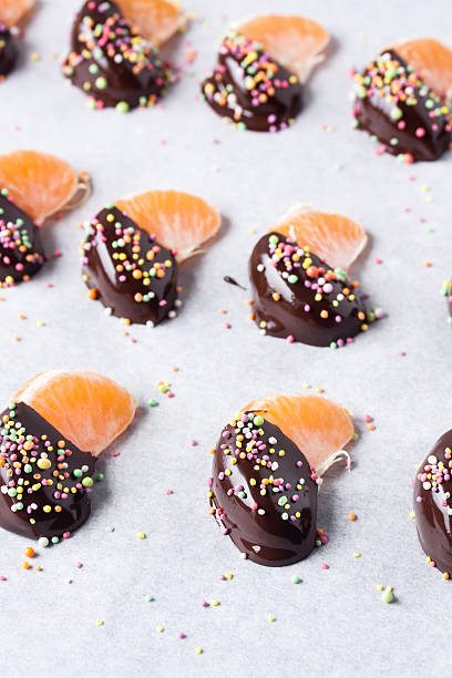 istock mandarine, tangerine fruits covered chocolate 636083124