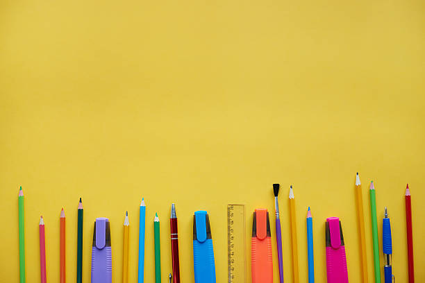 istock School supplies showing in a row 636083266