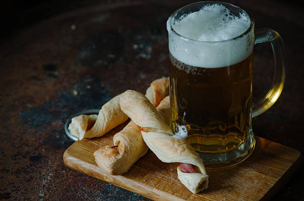 istock Bacon sticks pastry  with a glass of beer 636083530