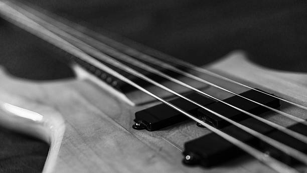 istock Black and white picture of a 5 string bass guitar 636084276