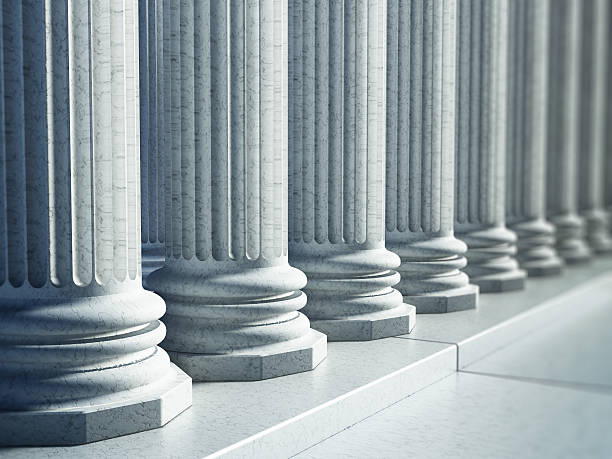 istock White Greek pillars along the road 636084292