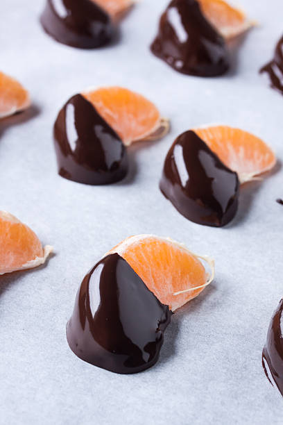 istock mandarine, tangerine fruits covered chocolate 636084410