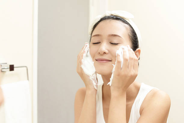 istock Woman washing her face 636086862