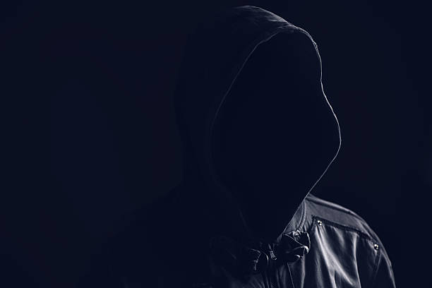 istock Unrecognizable faceless spooky hooded hooligan 636087126