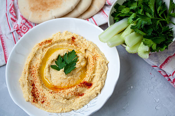 istock Home classic hummus with celery, pita. 636087134