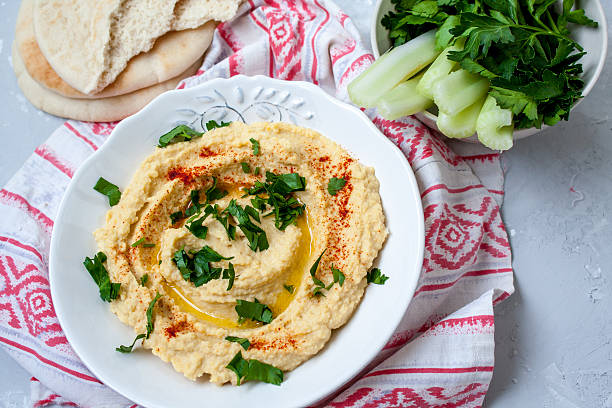istock Home classic hummus with celery, pita. 636087336