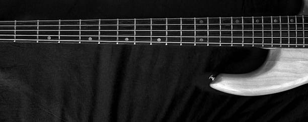 istock Horizontal vintage 5-string bass guitar Black and White 636088076