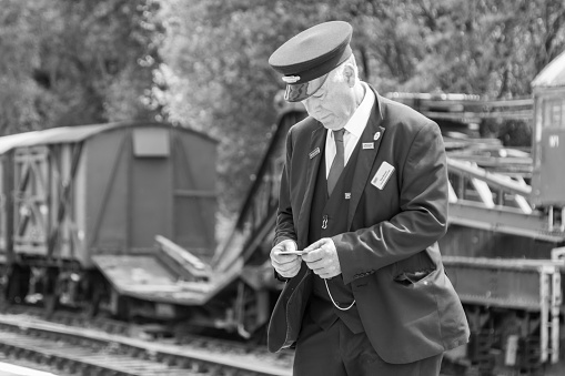 Swanage, England - May 28, 2015: Photo of ticket inspector at train station Swanage.