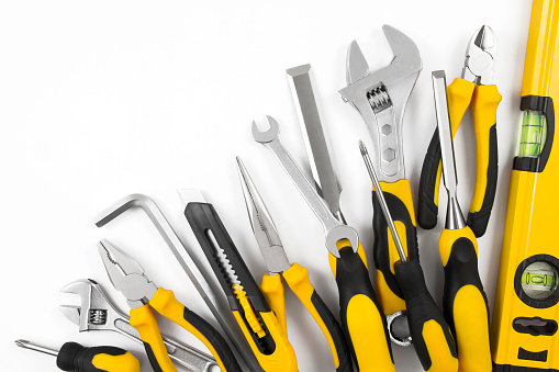 Lots of different work tools isolated on white background with copy space.