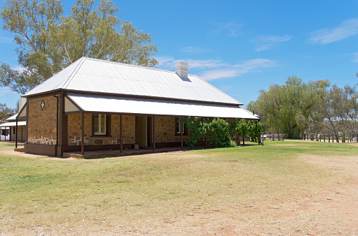 Alice Springs, NT, AUSTRALIA – October 26, 2016: Telegraph Station stationmaster building within the Alice Springs Station Historical Reserve is the site of the first European settlement in central Australia. Established in 1872 to relay messages between Darwin and Adelaide, it operated for 60 years upon completion in 1872. 