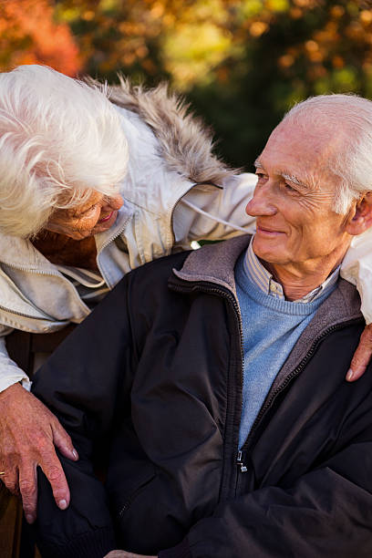 istock A senior woman tenderly looking at her husband sitting 636097418