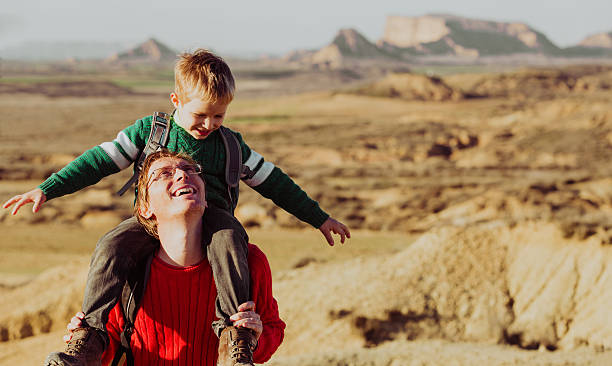 istock father and son travel in scenic mountains 636097660