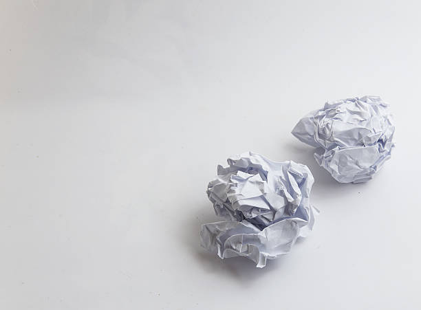 istock Two Crumpled paper Balls Isolated on white background 636097856