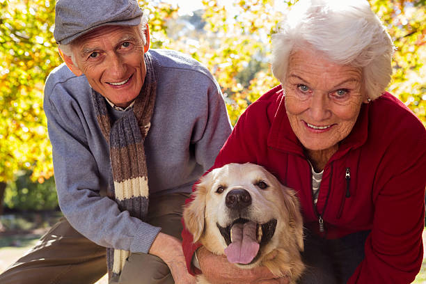 istock Elderly couple with their pet dog 636099652