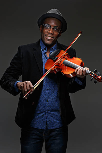 istock The black man happy expression and music instrument 636100358