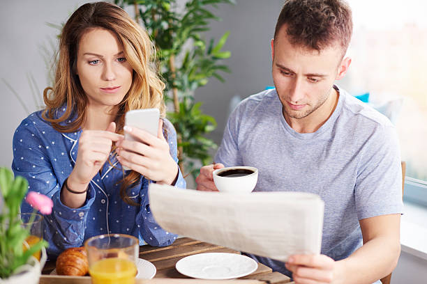 istock Couple enjoying breakfast in dining room 636102214