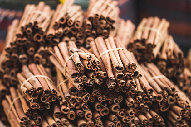 Stack of cinnamon sticks on the counter market