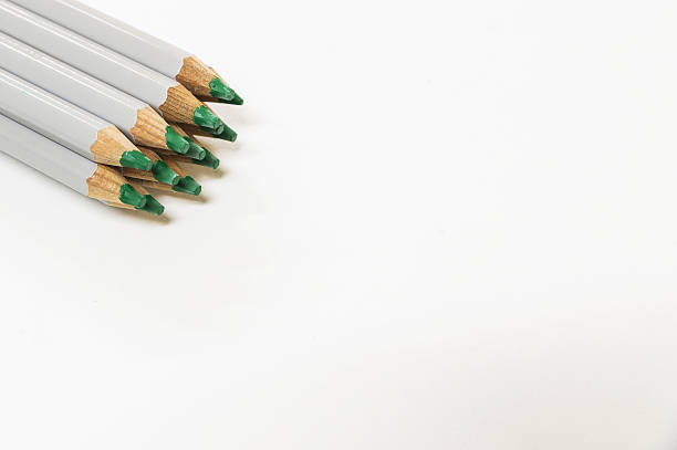 istock Green pencils on white background 636103412