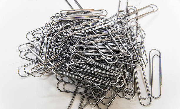 istock Pile of Iron Paperclips 636103698