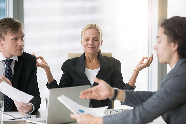 istock Business negotiation, men arguing, woman meditating 636103716