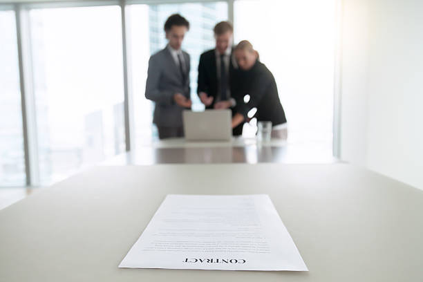 istock Closeup of a contract on office desk 636103996