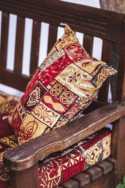 istock Traditional oriental decoration cafe, colorful pillows with hand 636104378