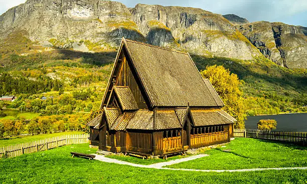 brown wooden stavechurch in endless norwegian lonelyness