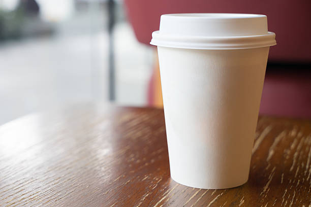 istock Paper coffee cup on coffee shop 636115958