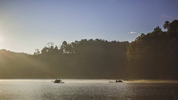 istock romantic travel, bamboo rafting on river at Pang Oung 636117078
