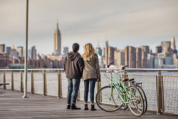 istock Couple looking at Empire State Building 636119020