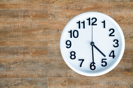 Clock show 4 am or pm and 30 minute on wood background with copy space. clipping path in picture.