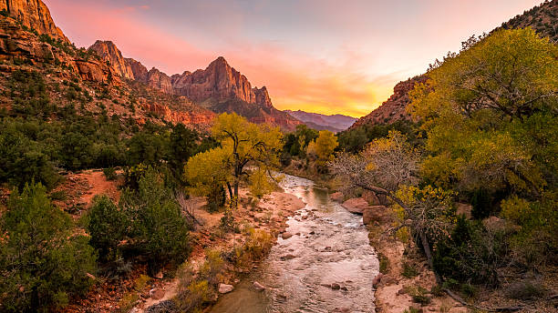 istock The rays of the sun illuminate red cliffs and river. 636119644