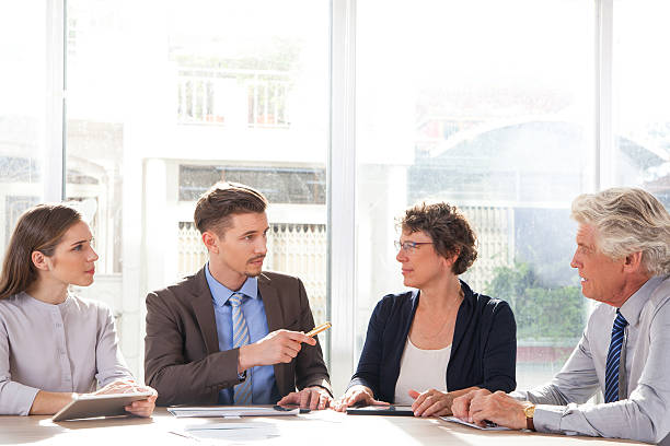 istock Serious young businessman holding meeting 636120582