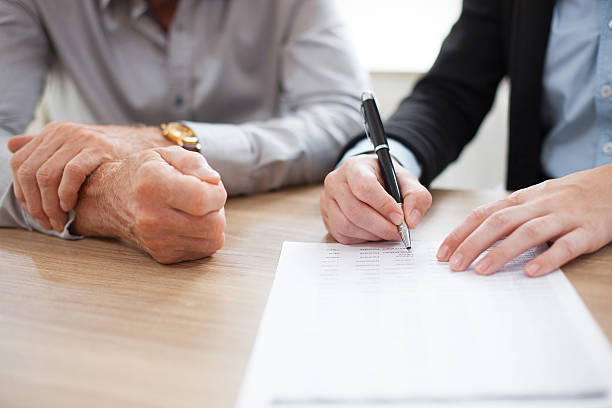 istock Unrecognizable woman signing contract at meeting 636120720
