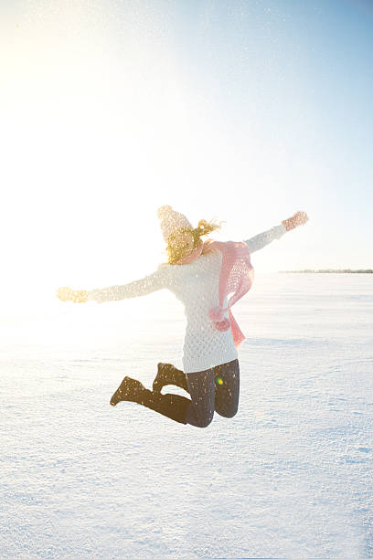 istock Happy blonde in winter clothes on field 636120868