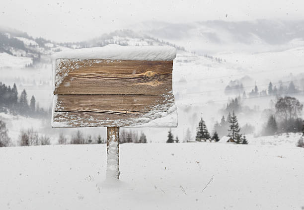 istock Wooden signpost with snow and mountains 636120990