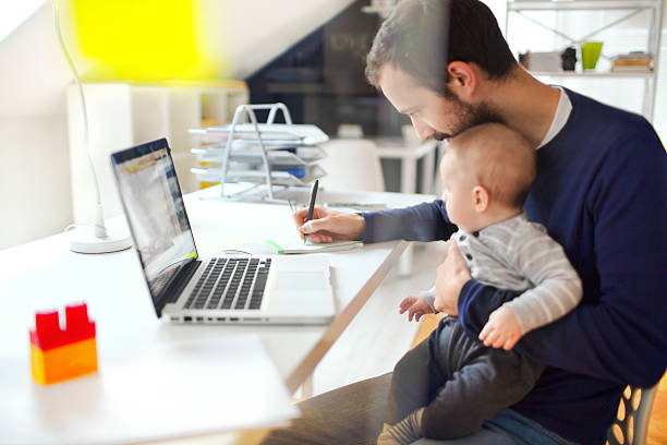 Working dad Little baby boy is spending time in his dad's office fashionable dad stock pictures, royalty-free photos & images