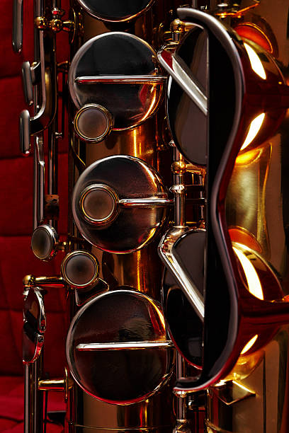 istock Fragment of Tenor saxophone is lightning from inside. 636123550