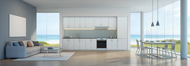 istock Sea view kitchen, dining and living room in beach house 636123916