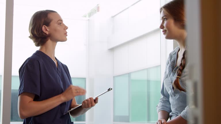 Doctor Meets With Teenage Patient In Exam Room Shot On R3D