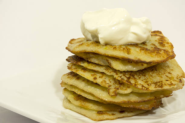 istock fried potato pancakes, sour cream, sauce, Breakfast; hearty 636135488