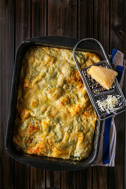 istock Green Vegetarian lasagna with spinach and ricotta cheese on wood 636135694