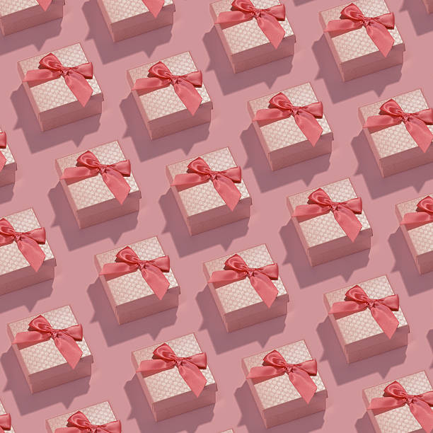 istock Pattern made of pink gift boxes on pastel background. 636138816
