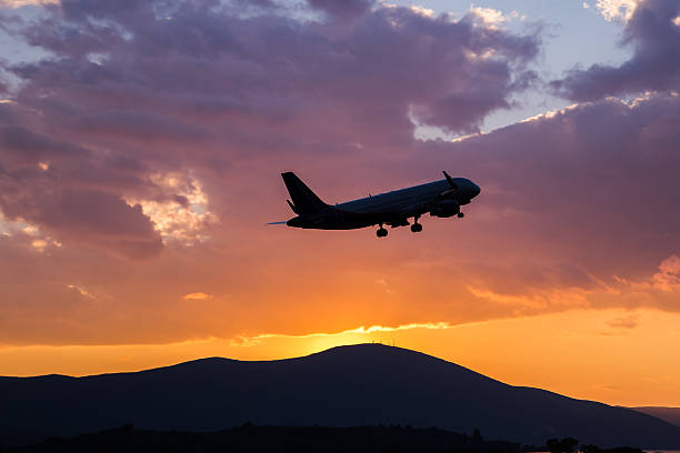 istock Passenger airplane flying in the sky at sunset 636140622