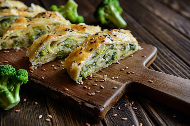 Strudel stuffed with broccoli, Mozzarella and onion Savory strudel stuffed with broccoli, Mozzarella cheese and onion strudel stock pictures, royalty-free photos & images