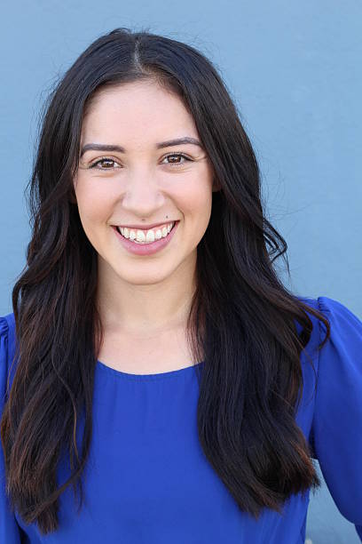 istock Young businesswoman isolated on blue background 636146742
