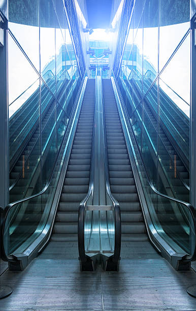 istock modern escalator in glass walls 636148582