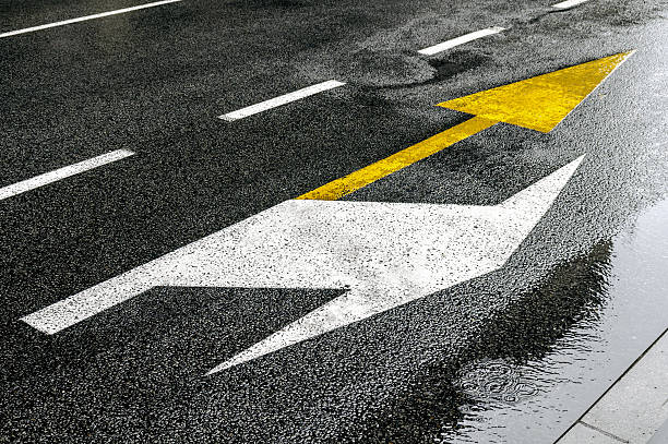 istock Buss yellow arrow showing straightforward and white right signs 636148730