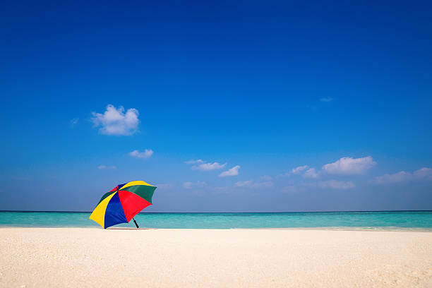 istock Beach umbrella on a sunny day, sea in background 636149208