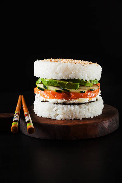 istock sushi like burger made from rice and smoked salmon, avocado 636149478